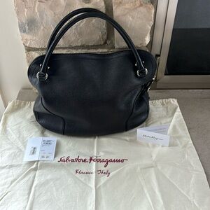 Authentic Salvatore Ferragamo black pebbled leather style is Bonaria